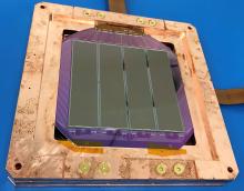 A DAMIC-M detector module with silicon CCDs. The module is enclosed in a high-purity copper frame for installation in the detector prototype.DAMIC-M Collaboration