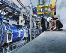 Researchers working to install the FASER detector at CERN.