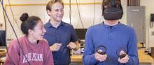A physics student wears an immersive headset to attempt a physics experiment in virtual reality.