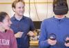 A physics student wears an immersive headset to attempt a physics experiment in virtual reality.