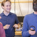 A physics student wears an immersive headset to attempt a physics experiment in virtual reality.